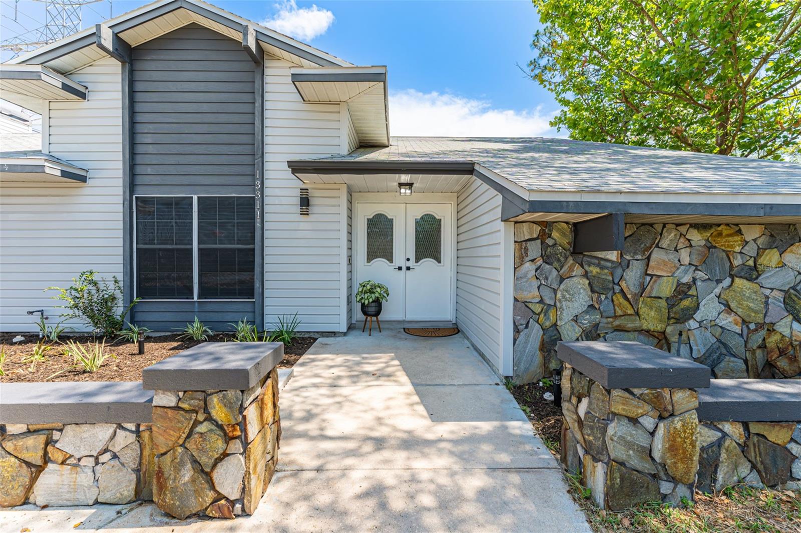 Stone walls framing your double door entryway