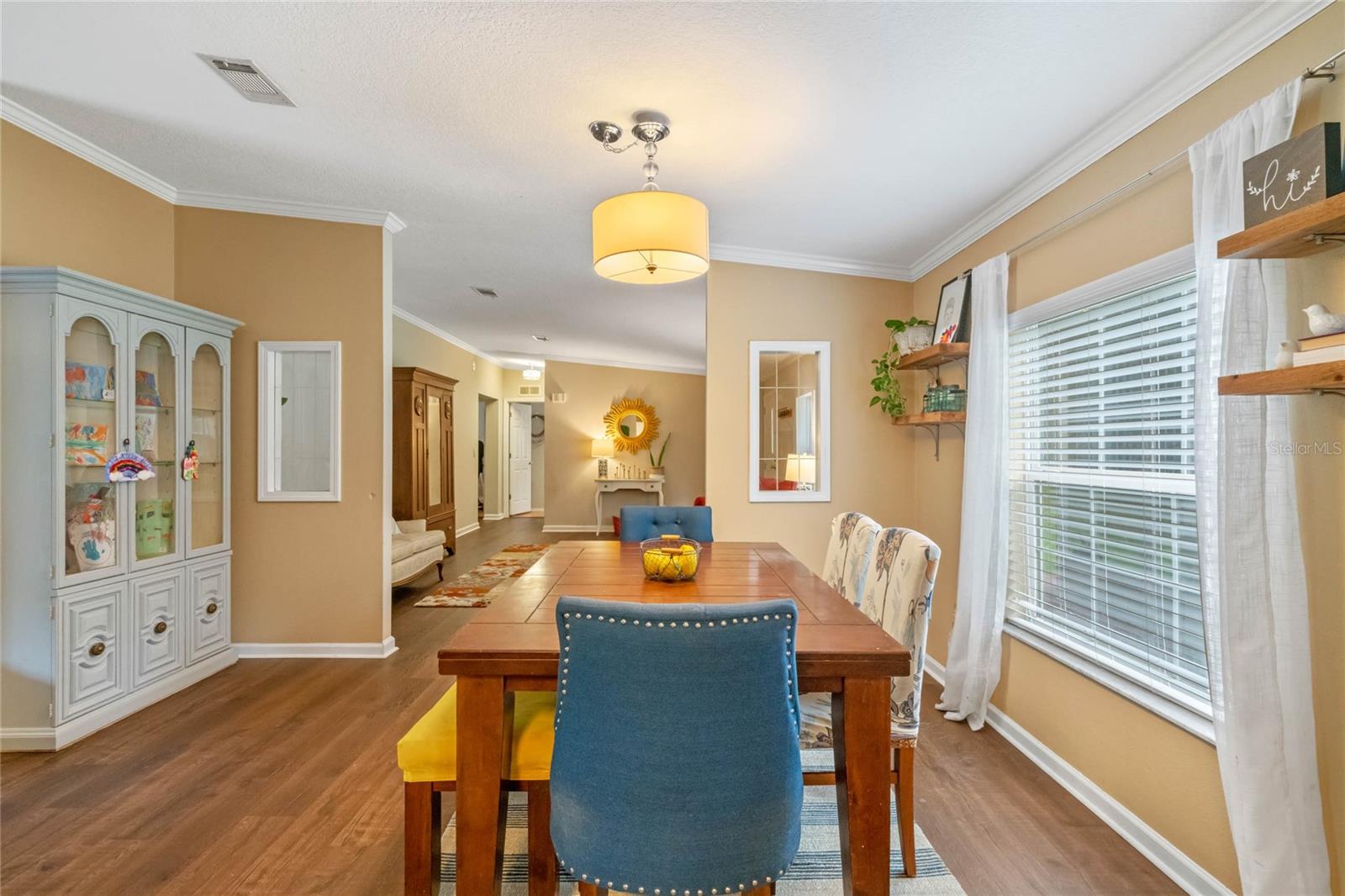 Spacious dining room with large window.