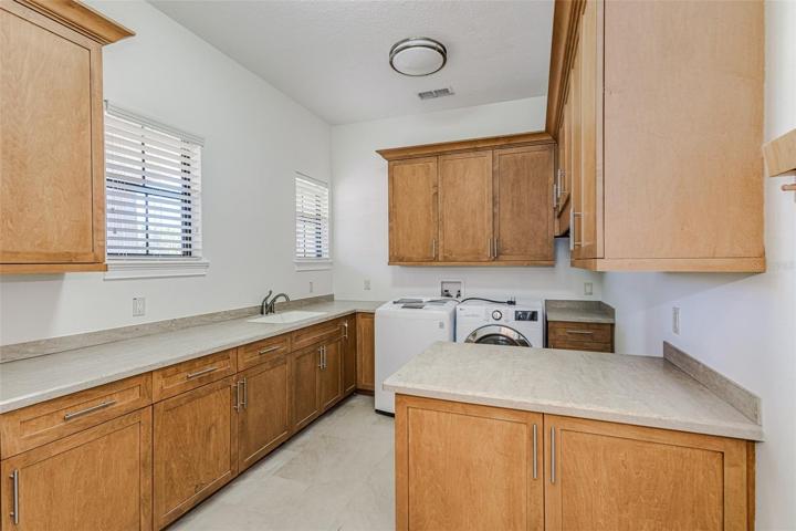 Laundry room as of 9/4/2023 updated interior paint & now vacant.
