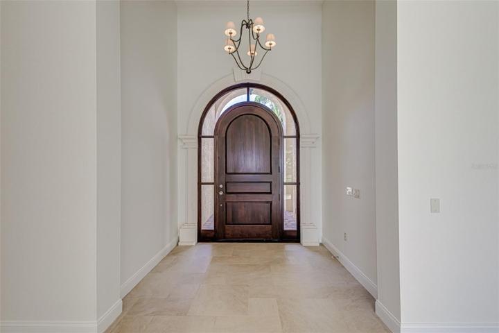 Freshly new wood stained door as of 9/4/2023
