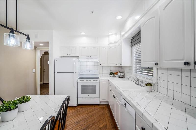 Kitchen with plenty of cabinet space and sitting area.