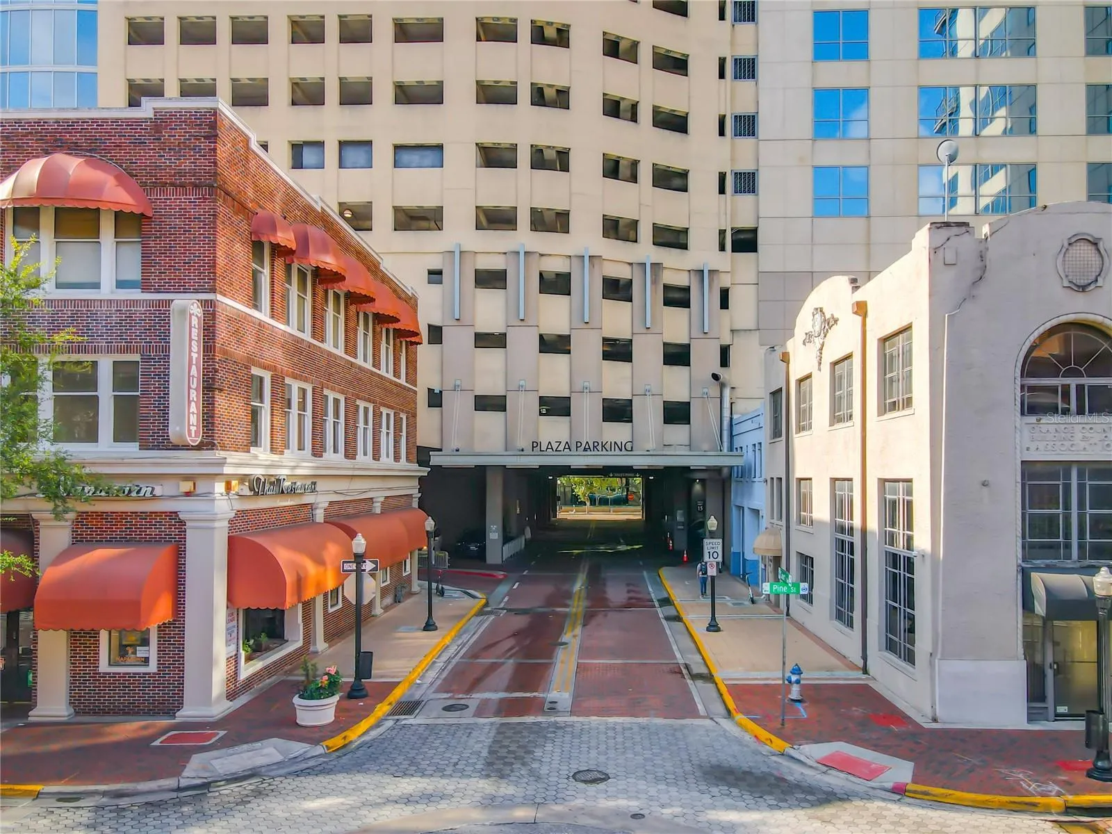 street entrance and 1 assigned parking space in the private covered garage.