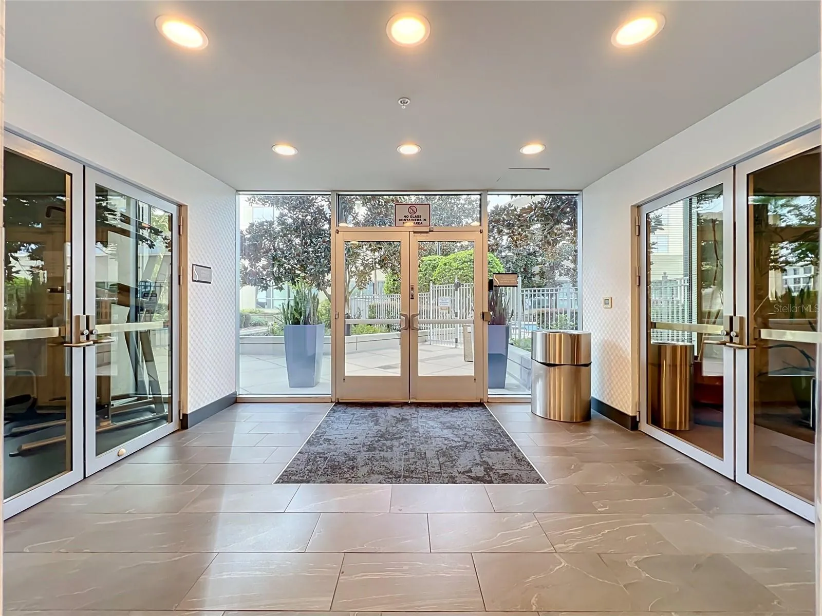 Entrance to pool and outdoor garden area, as well as gym and