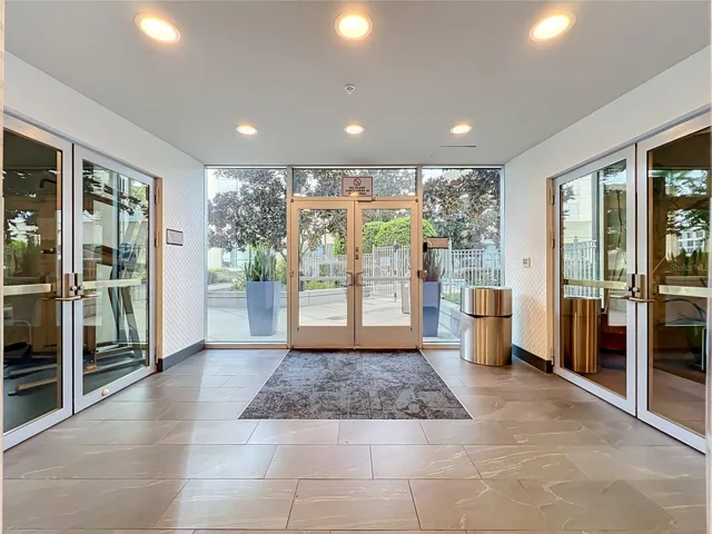 Entrance to pool and outdoor garden area, as well as gym and