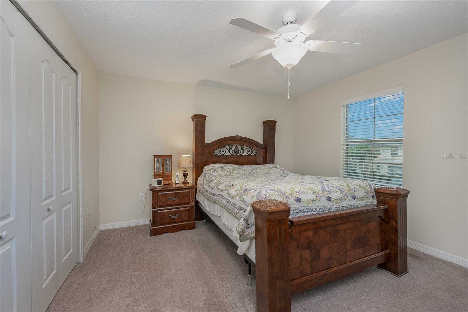 Lovely Screened-in back porch with storage area.