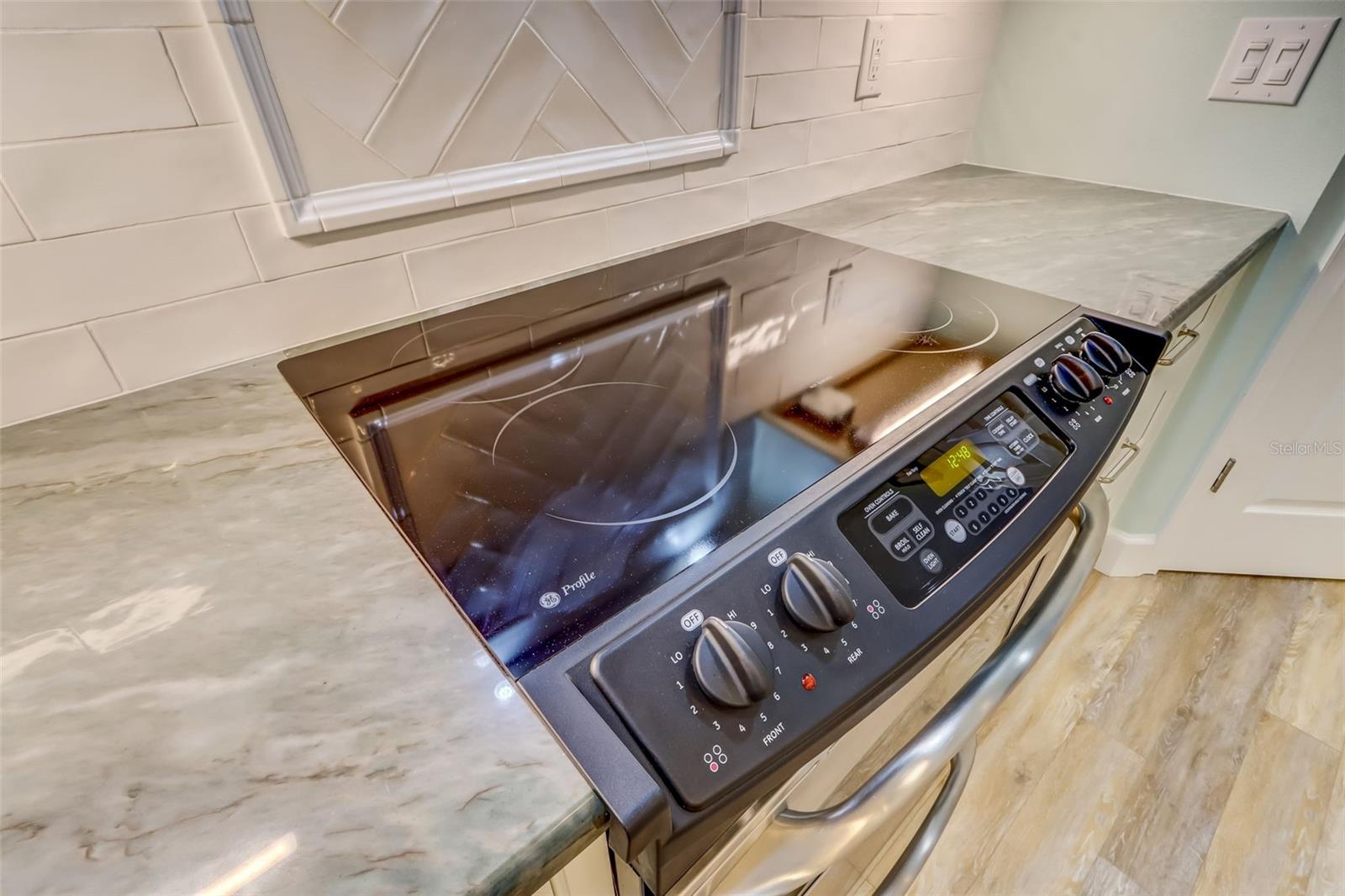 Stainless Steel Appliances. Custom backsplash