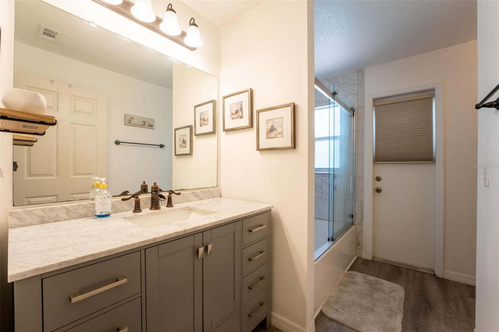 Hall Bath with Entrance to the Pool Area