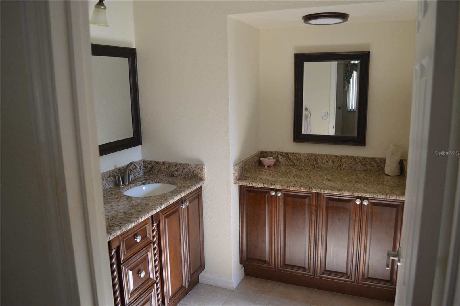 Extra vanity and counter space with mirror in master bath