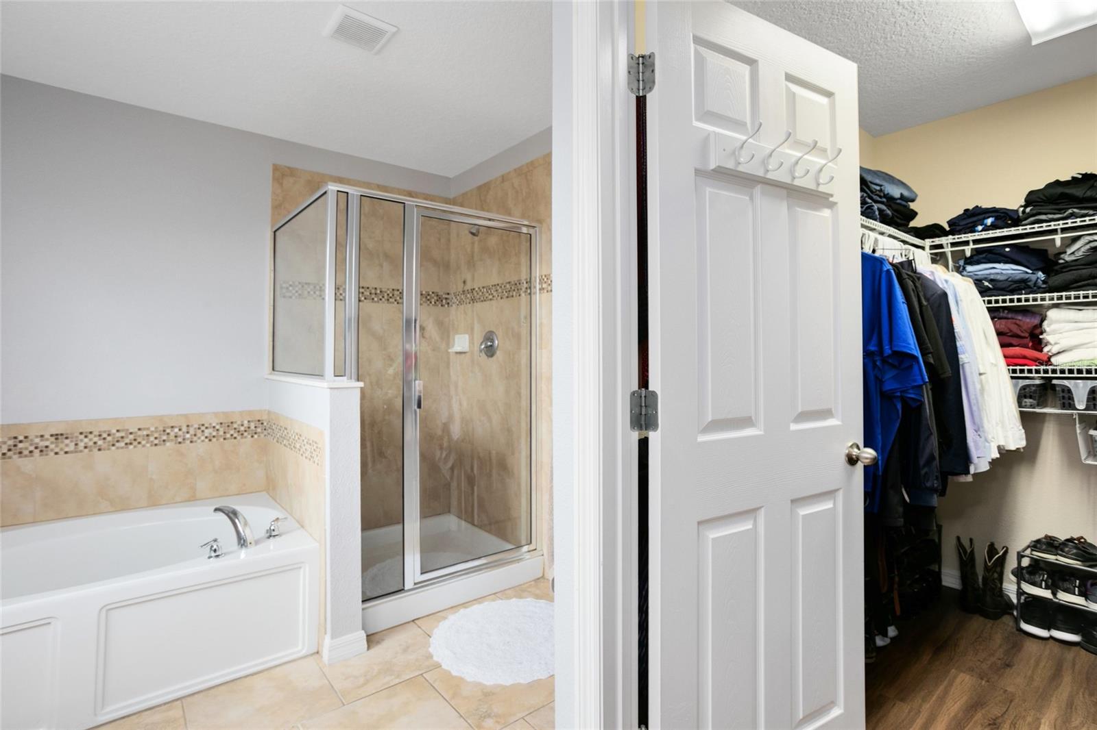 Soaker tub and standing shower as well as huge closet