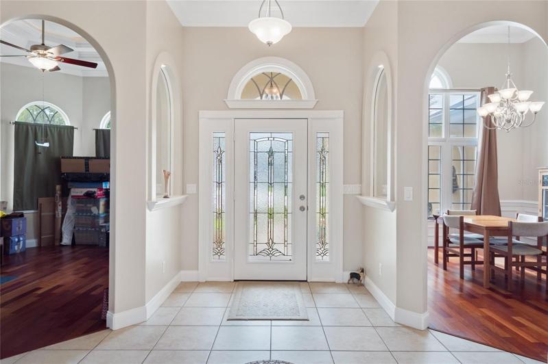 Grand Foyer with view in to Office/Den & Formal Dining room