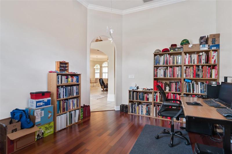 Office/Den with expansive hardwood flooring