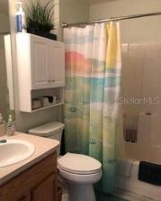 Guest bathroom with tub and shower.