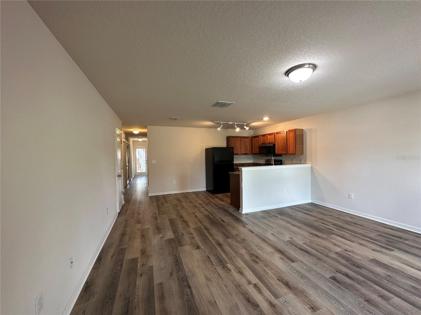 Great Room looking into Eat in Kitchen