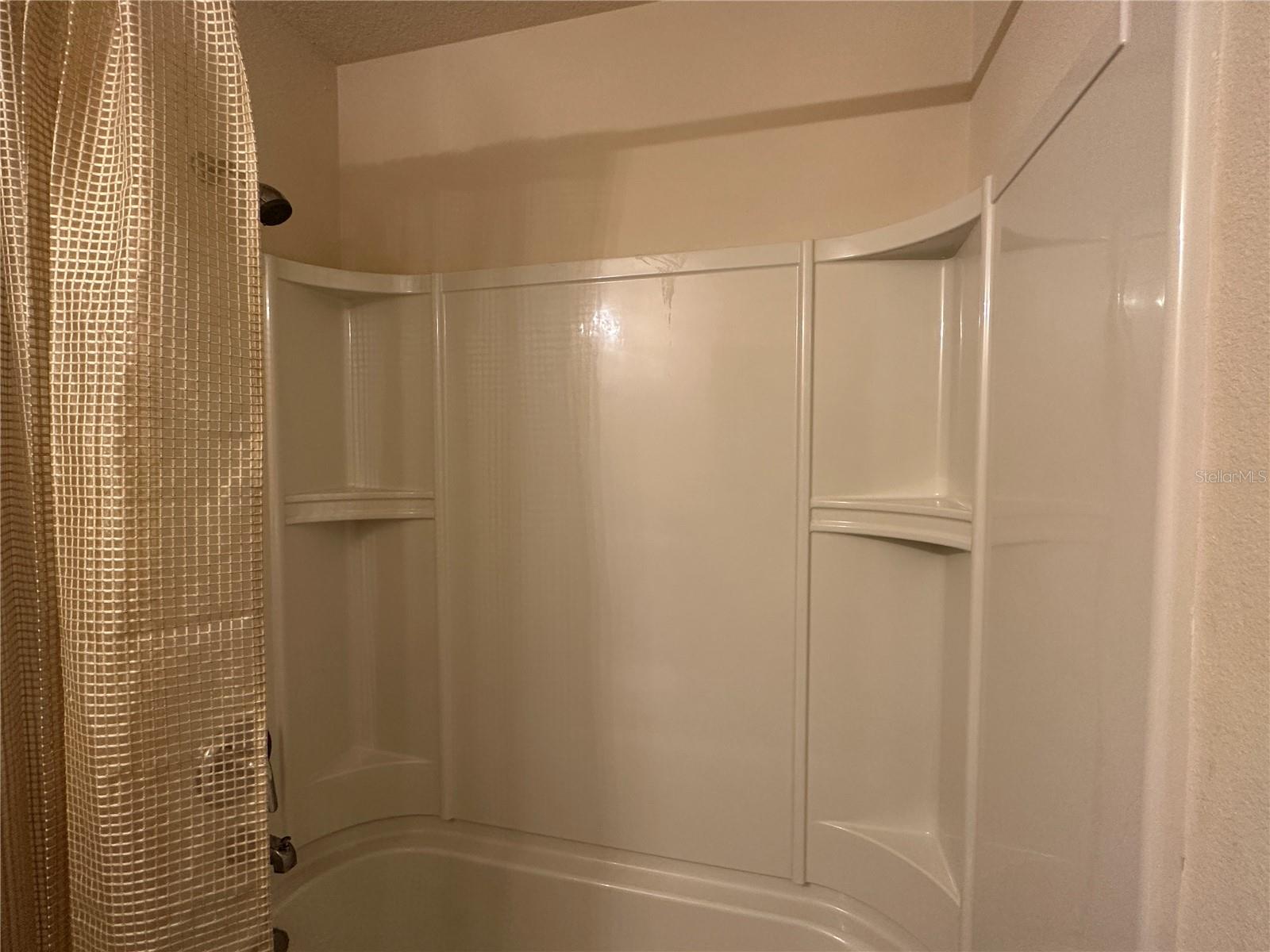 both baths have shelves