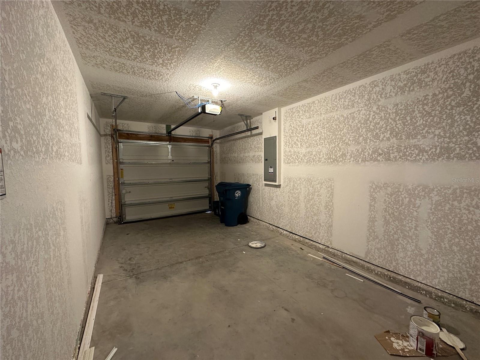 Garage with drywall walls could paint and use for office, den or bonus room.