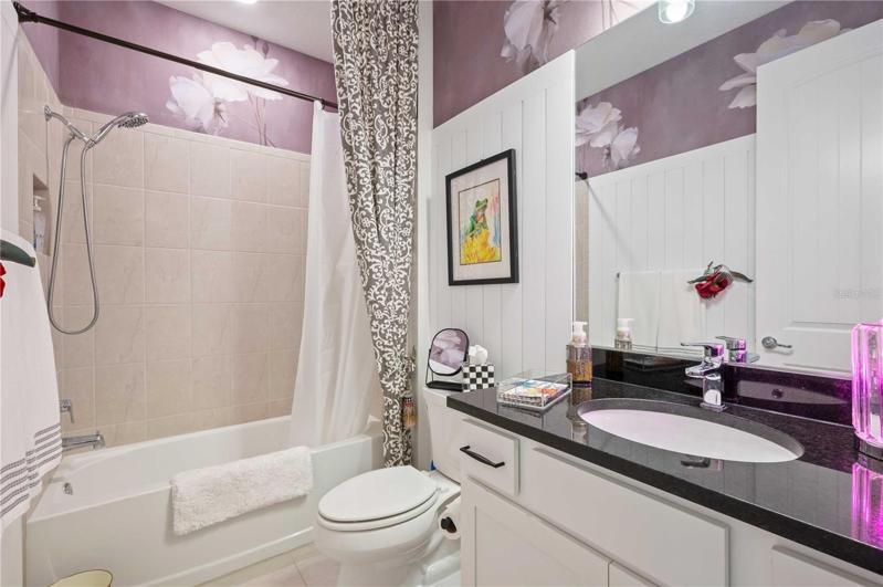 Guest bath is located between bedroom 2 & 3.