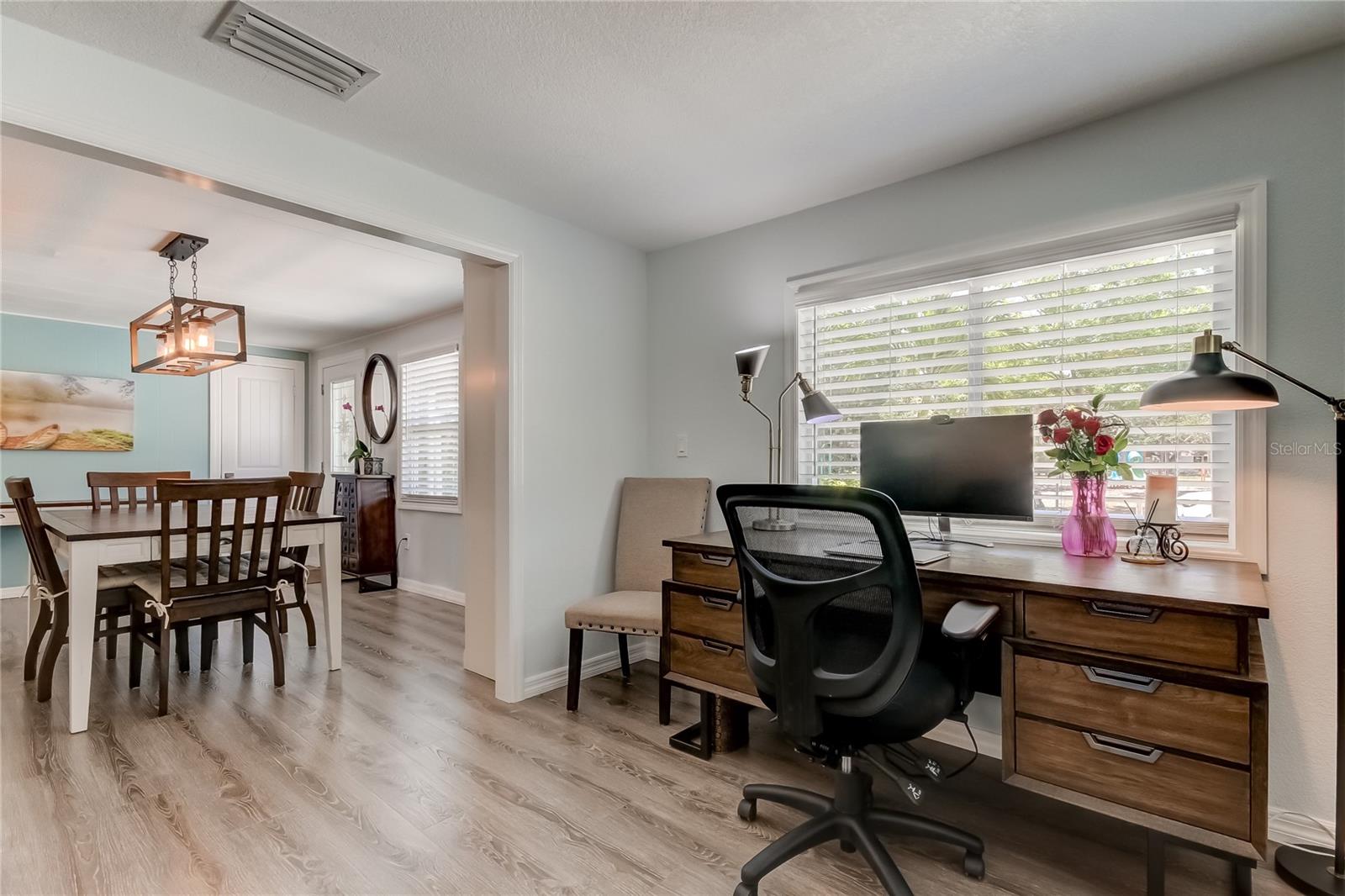 Dining Area Flows Into the Living Room.. also Being Utilized as an Office Area!