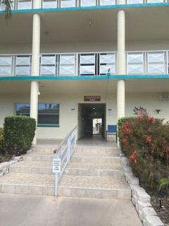 Front Entrance & Hallway to Elevator