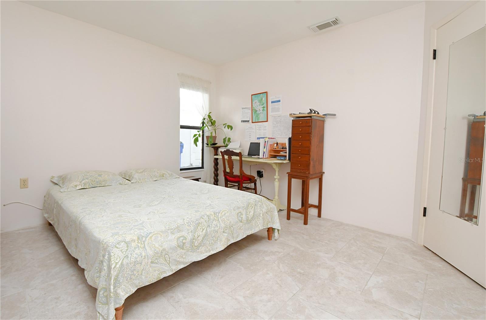 Bedroom one is spacious with an open feel.