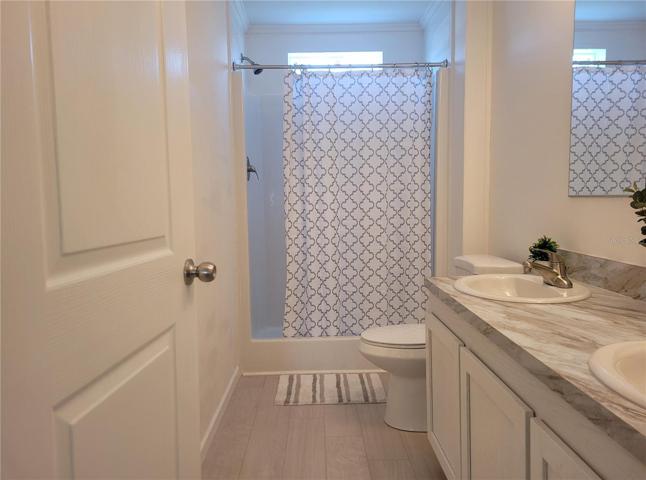 PRIMARY BATH SHOWER WITH DUAL SINKS