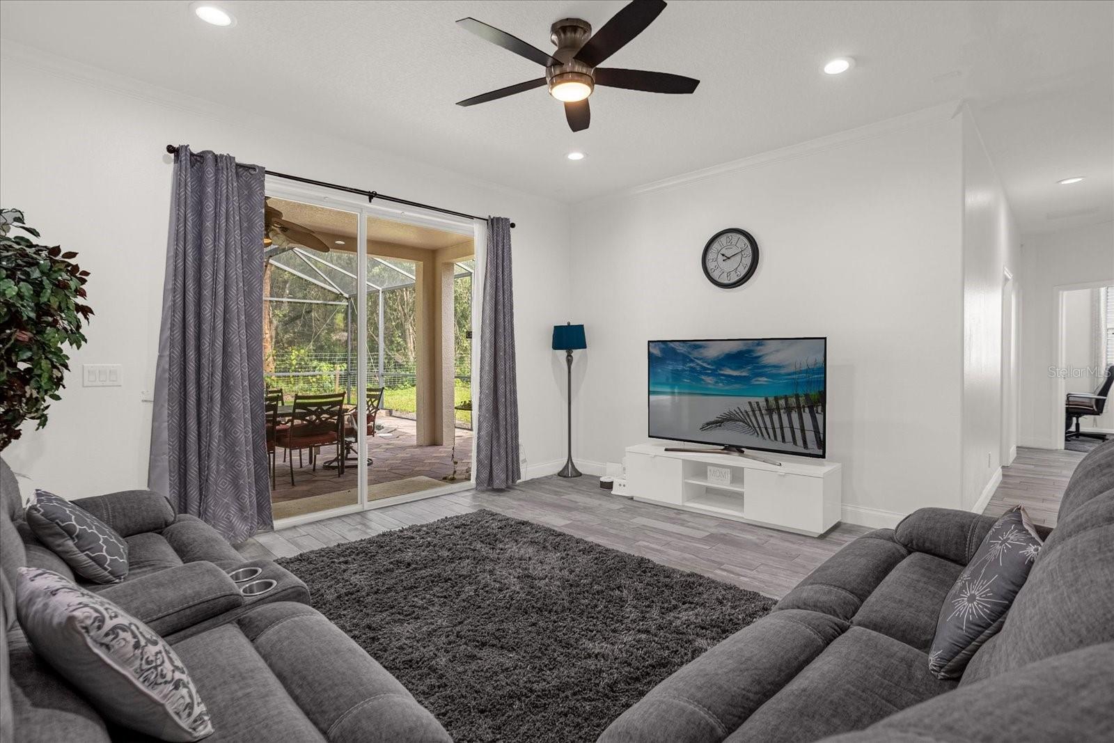 Family room is open to Kitchen and Casual Dining, great for entertaining and features a s slider to the private Lanai and Pool.