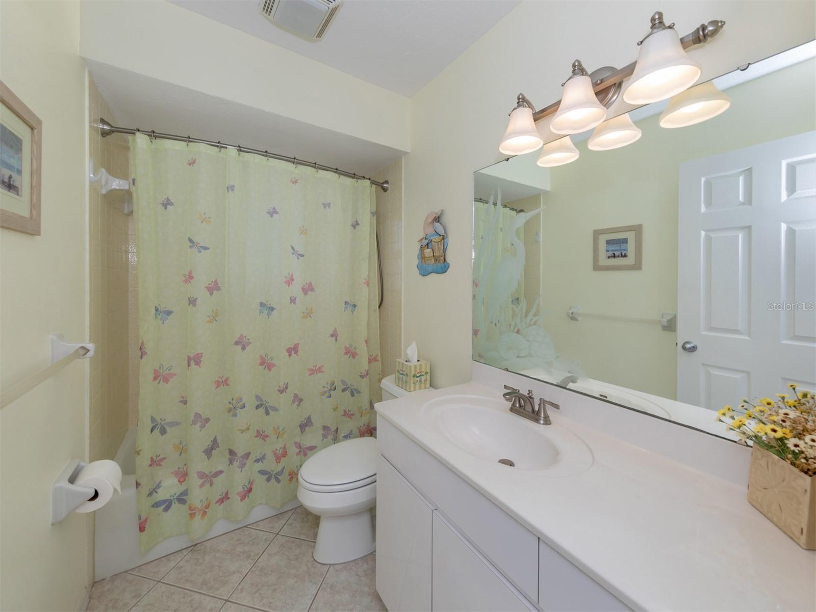 Guest bath with tub/shower.