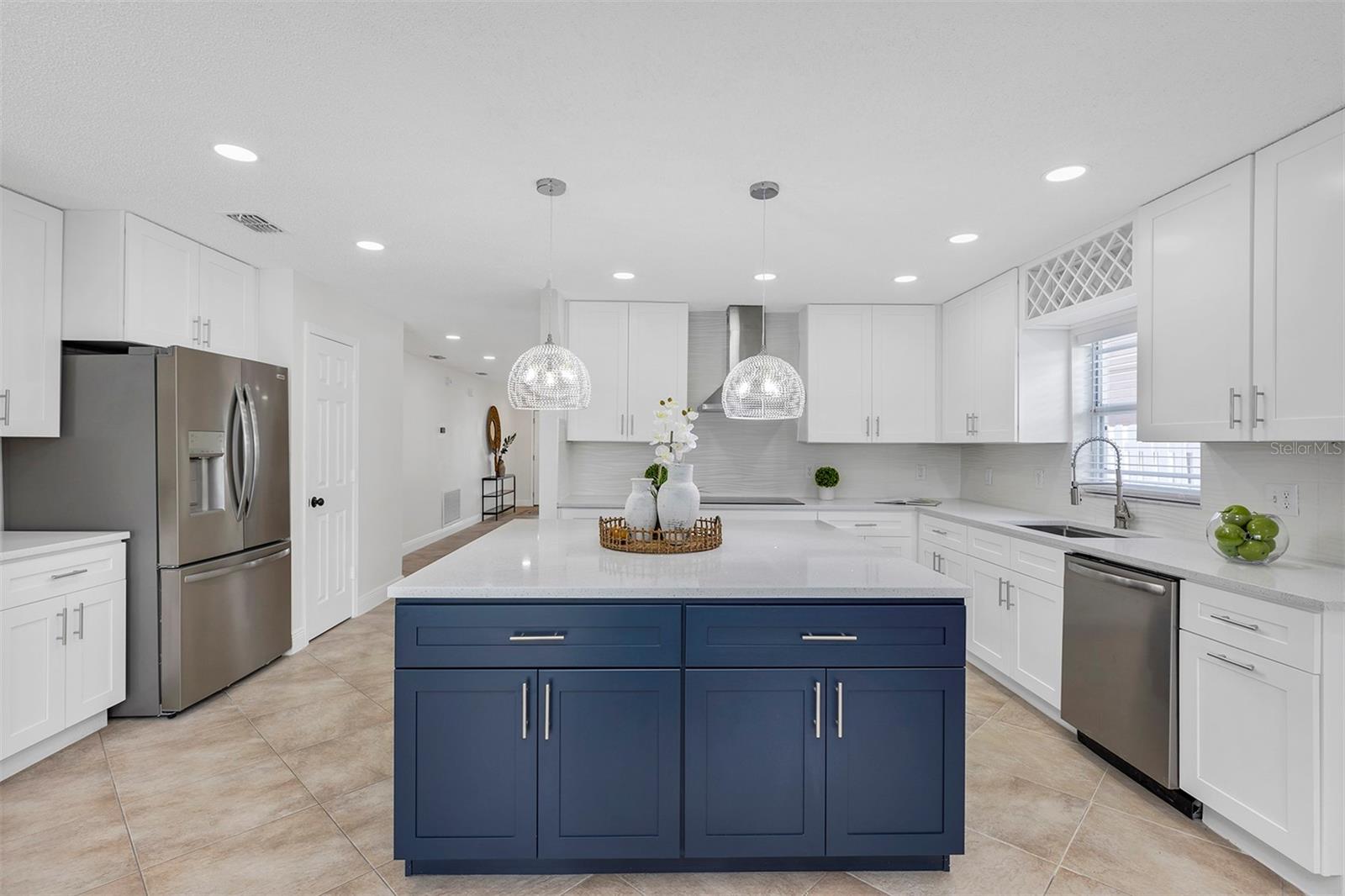 This kitchen is stunning with Italian Quartz sparkling island. Focus on the details and get mesmerized.