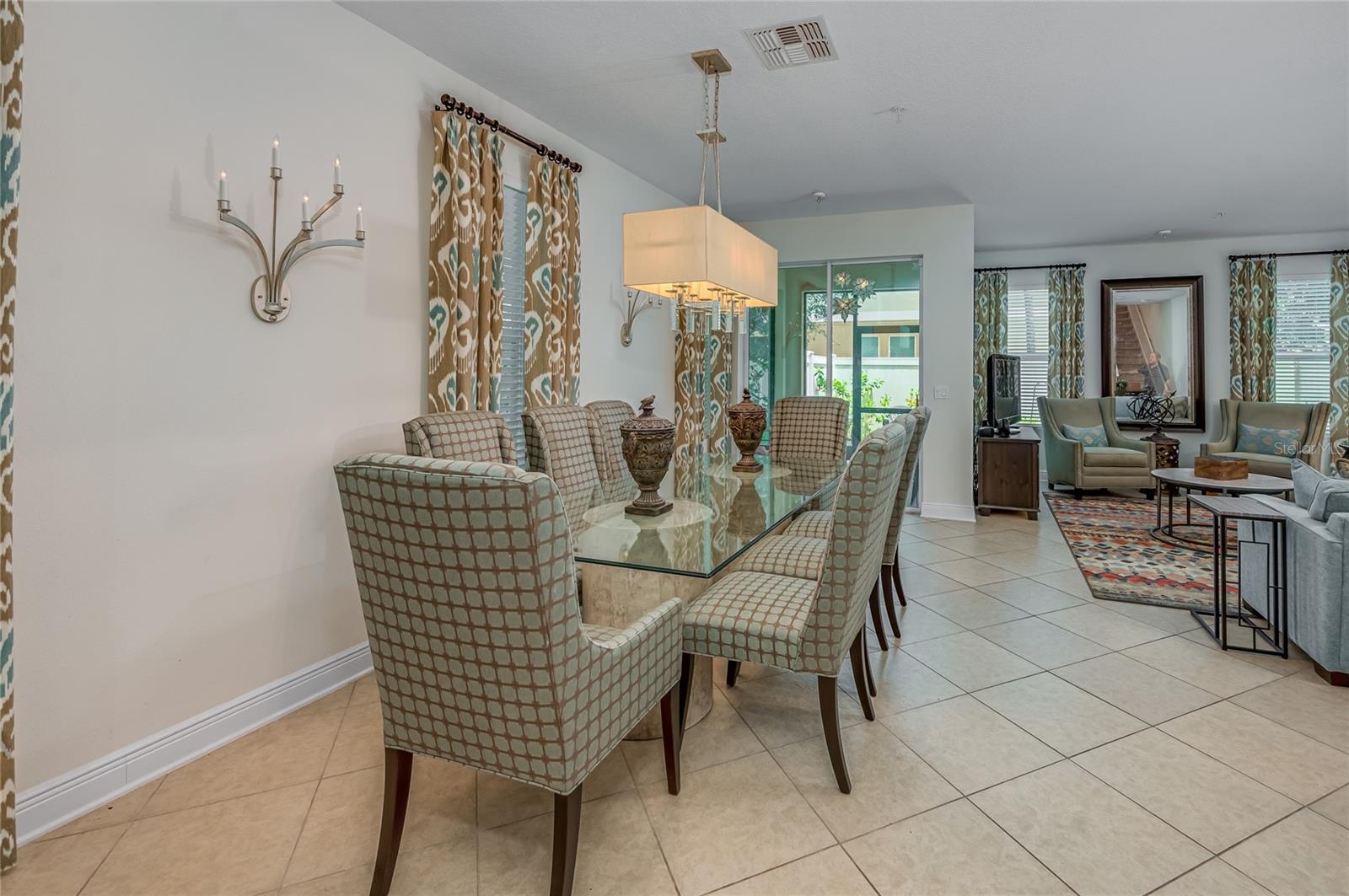 Dining room facing covered and screened porch - dining table and chairs included