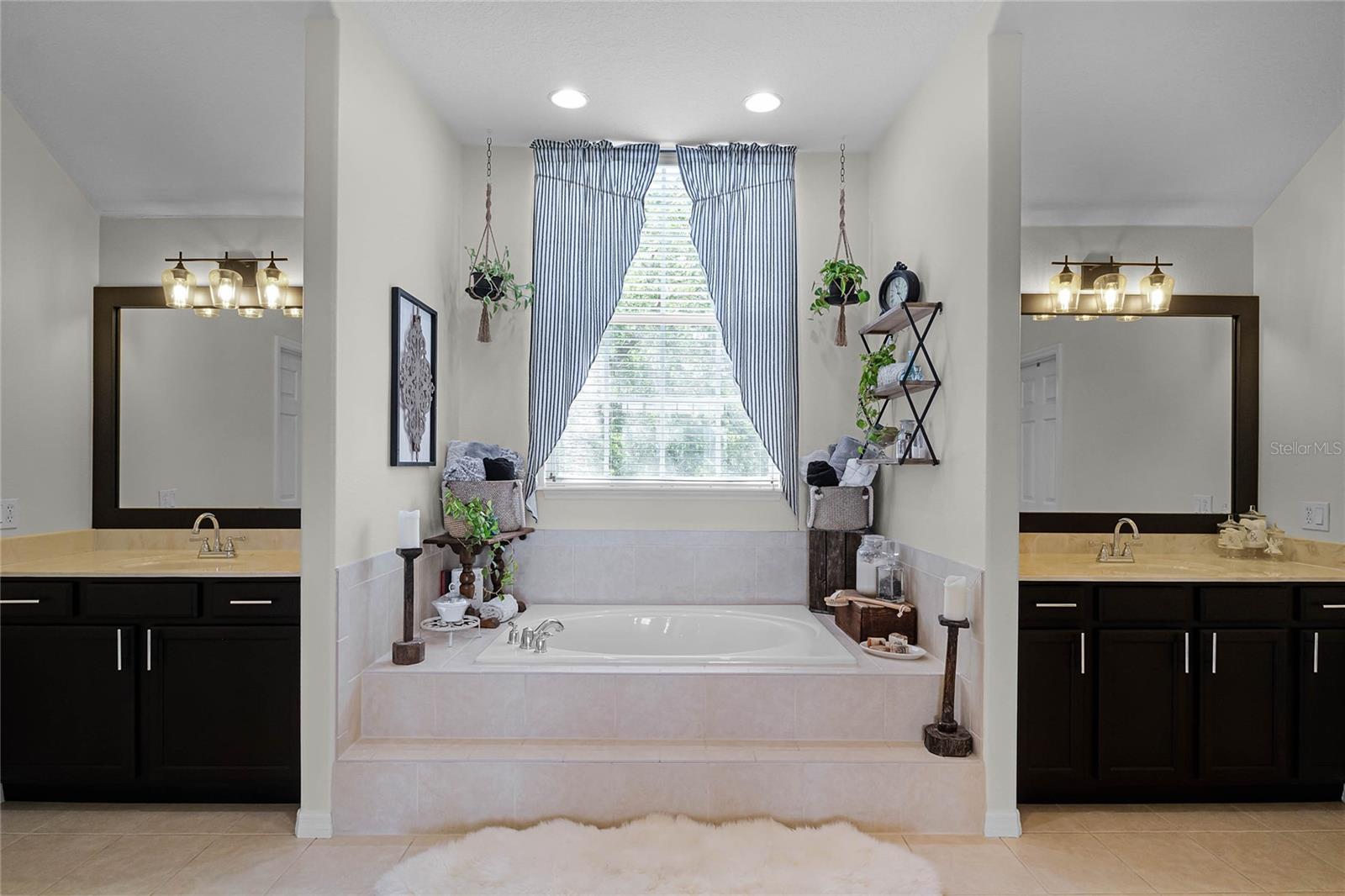 Owner's Bath dual sinks and soaking tub and shower, separate water closet, huge walk in closet to the Right