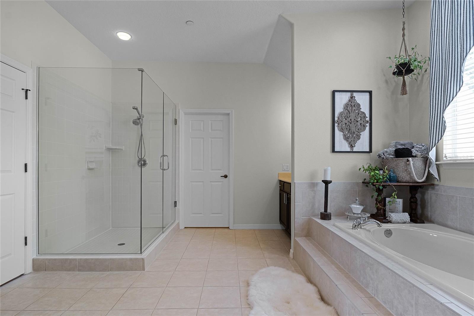 Owner's Bath door leading to Laundry and additional storage room
