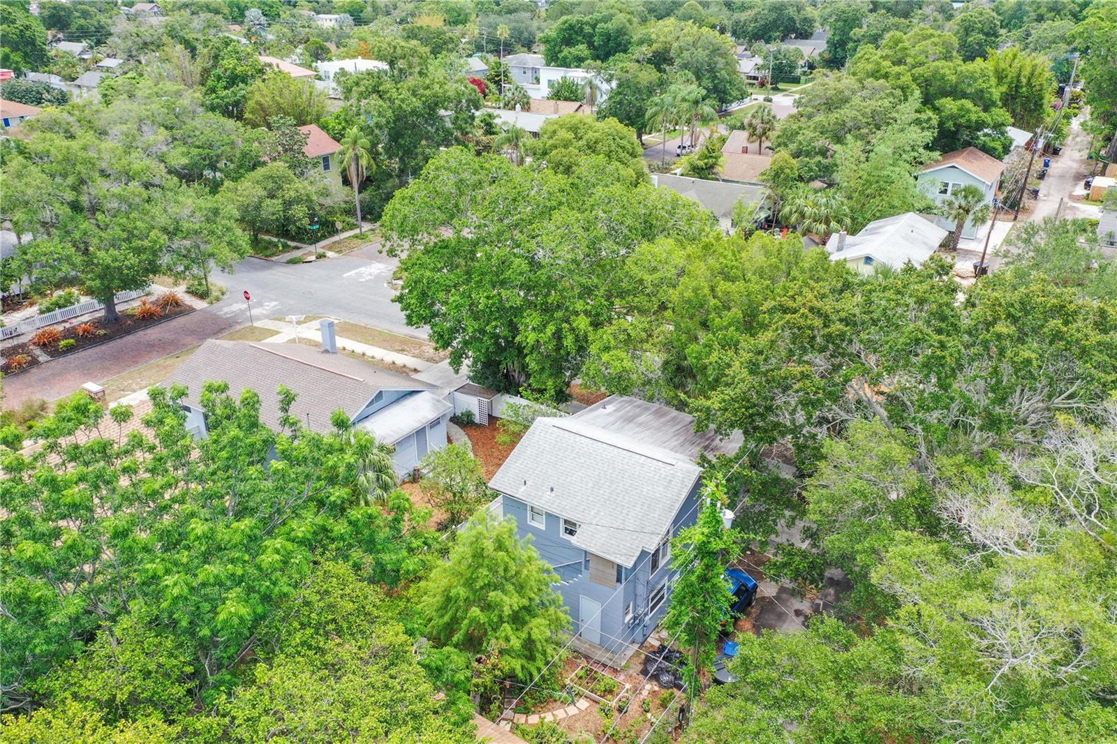 Drone view of property. 2 buildings on the corner