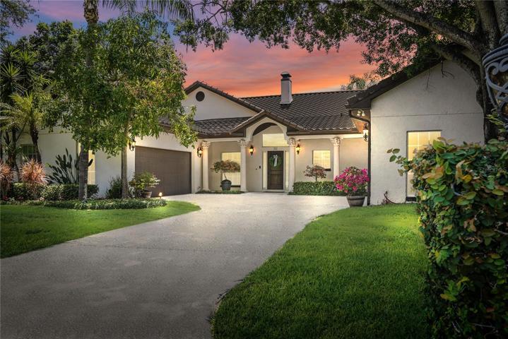 Charming Spanish Colonial with 2, two-car garages.
