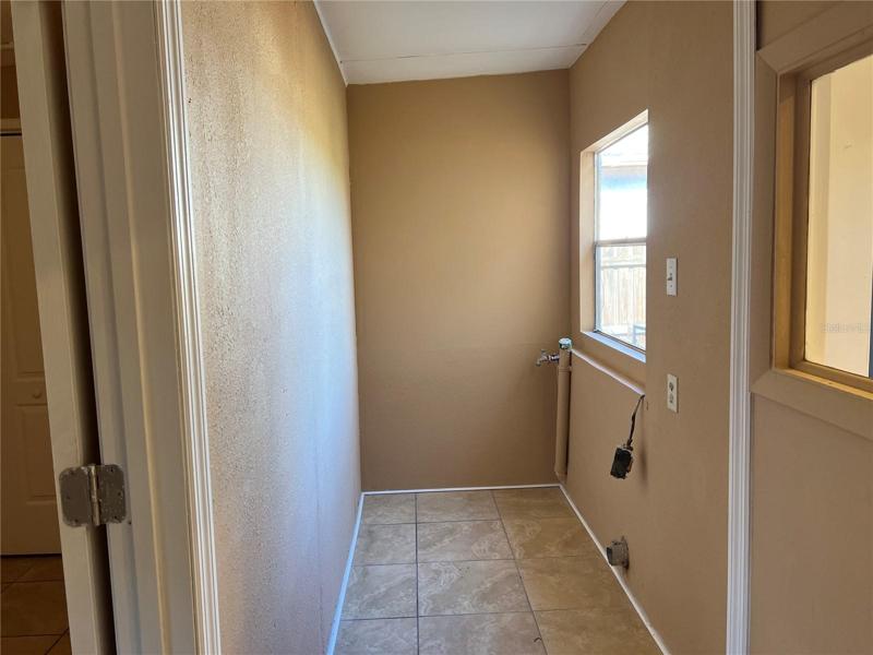 Washer and dryer space off the kitchen.