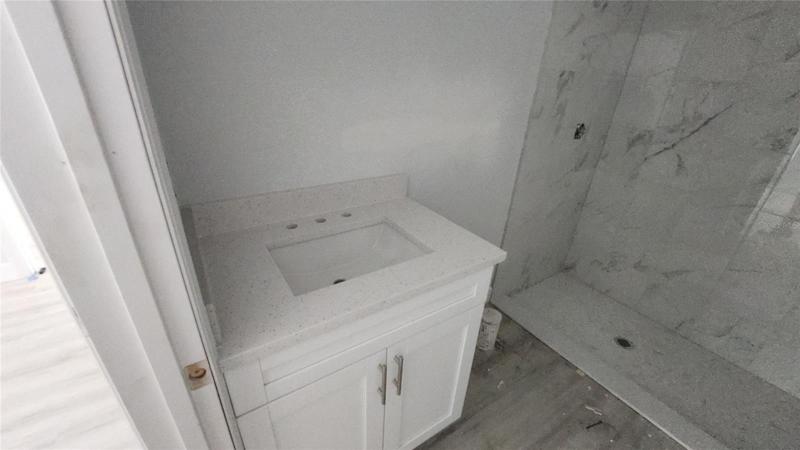 Master Bathroom featuring Quartz countertops.