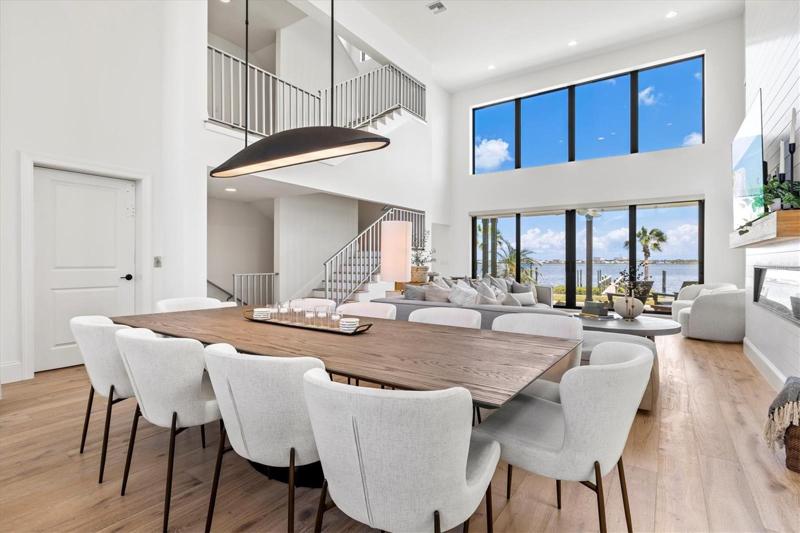 Dining and living room with river views.
