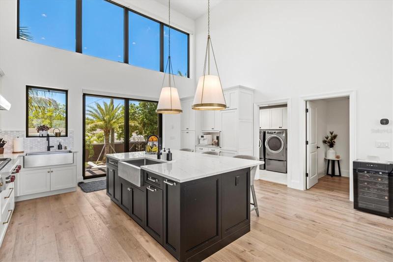 Kitchen with adjacent laundry and powder room.