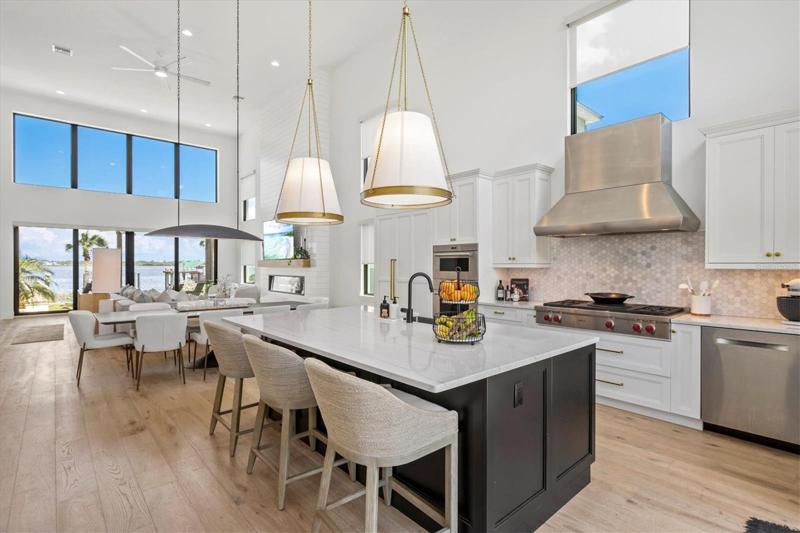 Kitchen features high end Wolf & Liebherr appliances, quartz countertops.