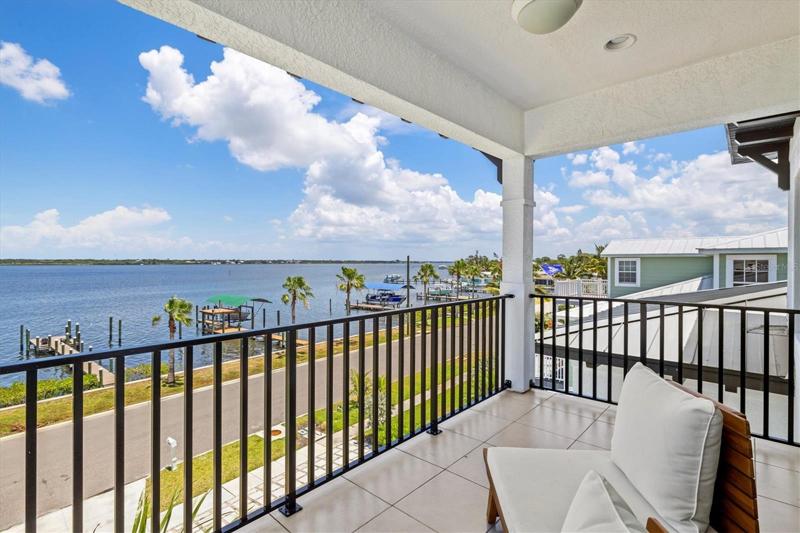 Balcony off the primary suite with river views.