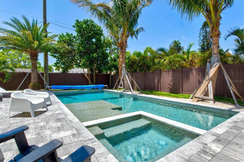 Amazing heated salt-water pool with spa and sun shelf.