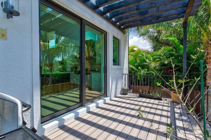 Backyard balcony with composite decking.