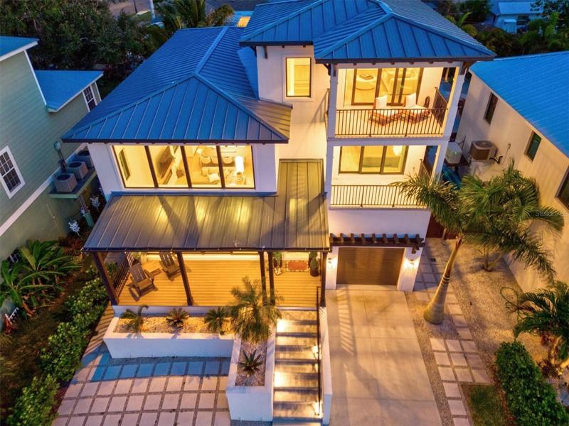 Twilight aerial of front elevation.