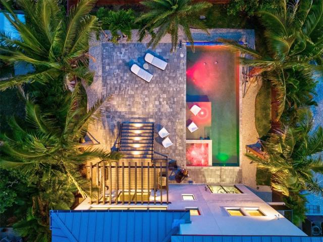 Twilight aerial of the backyard.