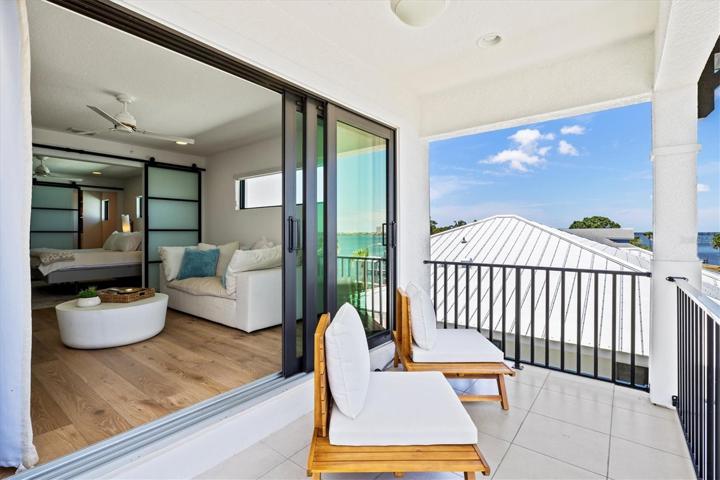 Balcony off the primary suite with river views.