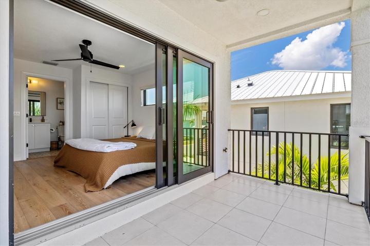 Bedroom 2 on 3rd level with en-suite bath and balcony with water views.