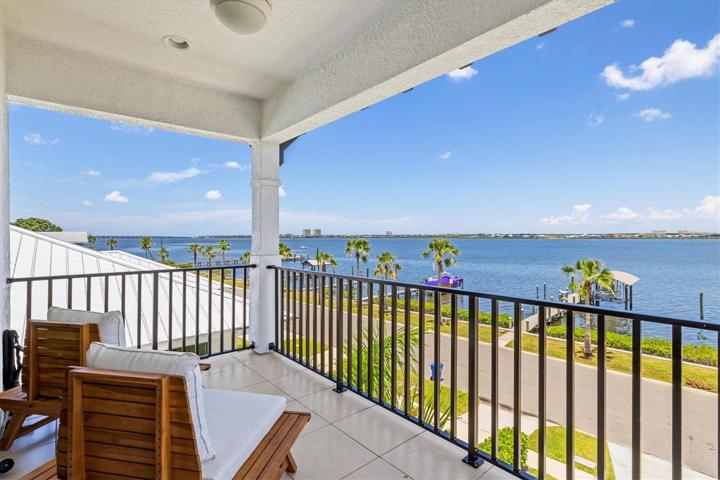 Balcony off the primary suite with river views.