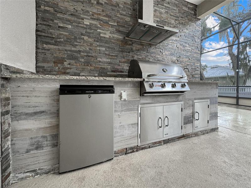 Outdoor Kitchen with Custom Stone backsplash
