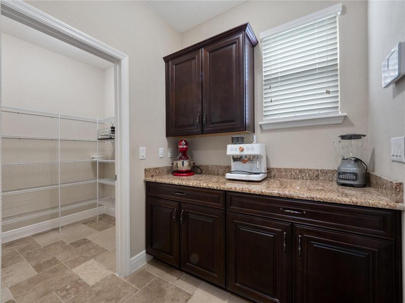 Drybar and pantry outside of kitchen