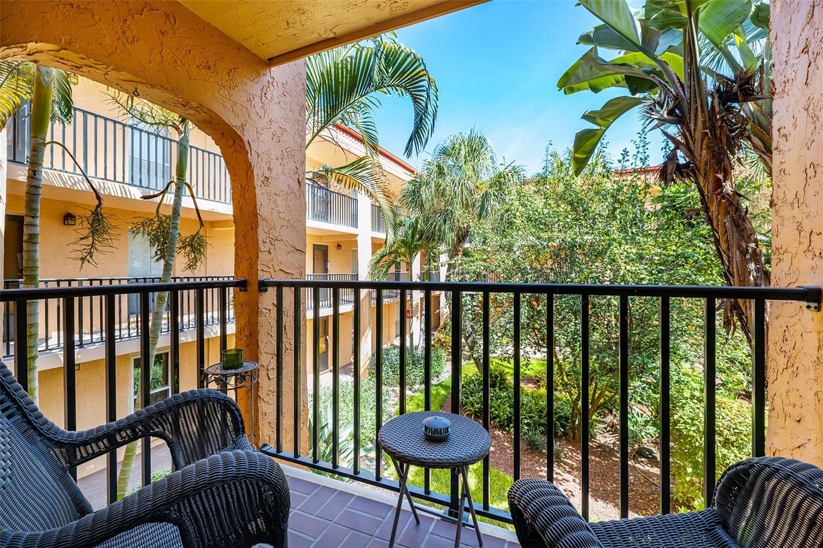 The view from your balcony overlooking the. courtyard