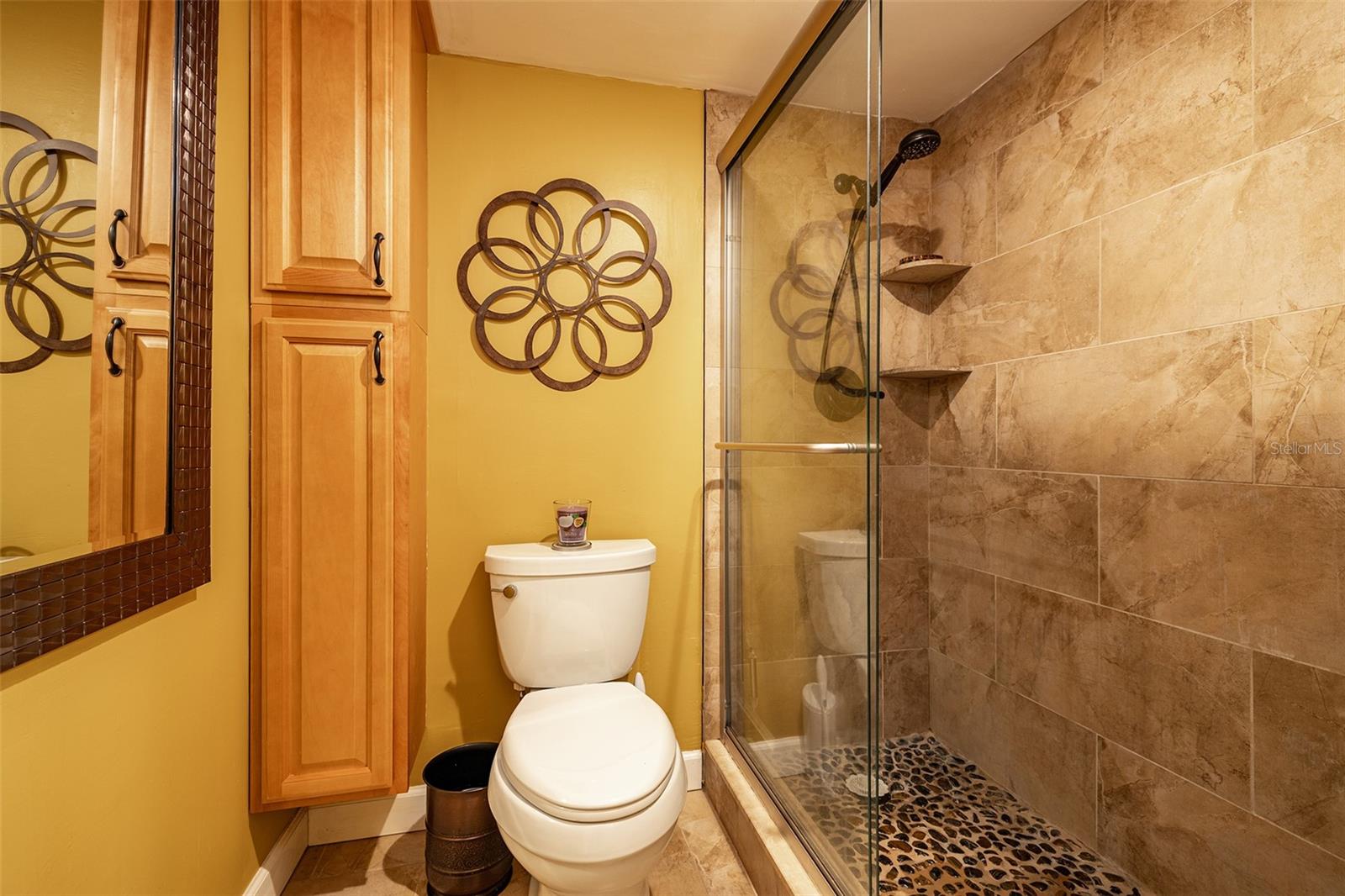 The bathroom has a walk-in shower for everyone's convenience