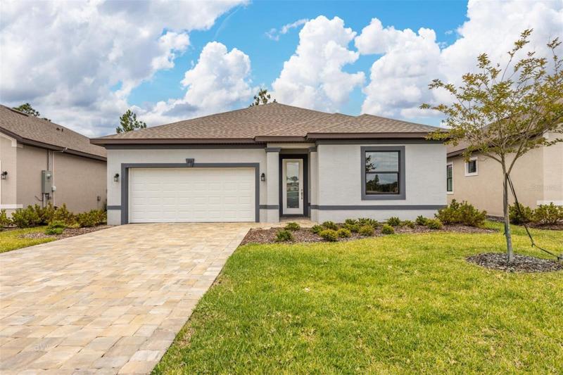 Pavered driveway, lawn care included in low HOA!